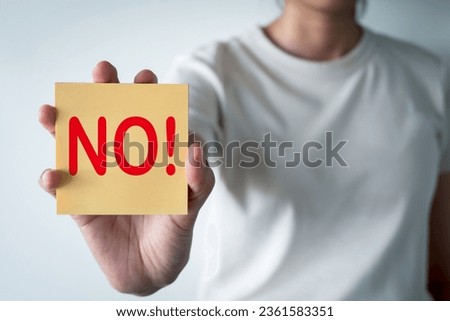Say no,vote,no sign concept.,woman holding yellow sticky note with no word.
