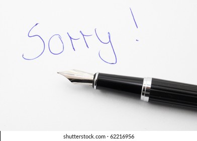 say sorry with a text message on paper and pen