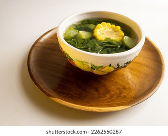 Sayur bening bayam, Spinach Clear Vegetable. Indonesian food of spinach, spinach soup with corn and chayote. selected focus