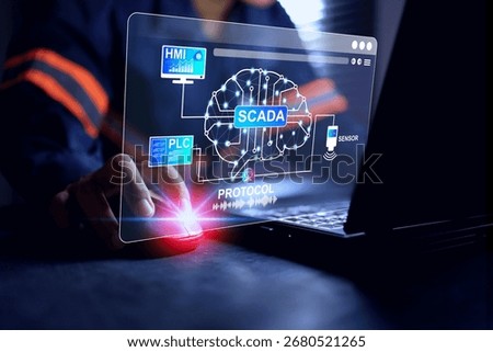 SCADA technology concept with a man programming and logic setting for real time checking and data analysis control process and monitor on human machine interface