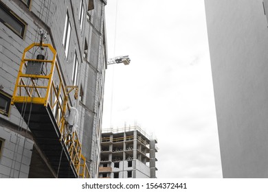 Scaffold Elevator Hanging On Building Under Stock Photo 1564372441