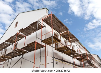 Scaffolding Covering A Facade Of An Old Building  Under Renovation 