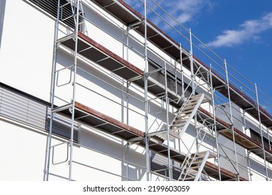 Scaffolding, Painting Work: Scaffolding On A New Apartment Building With White Facade Painting