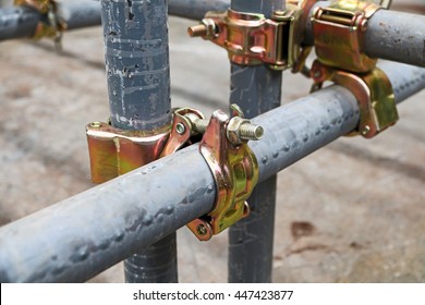 Scaffolding pipe clamp and parts, An important part of building strength to scaffold clamps in used close up on construction site,platforms for stage structure support
