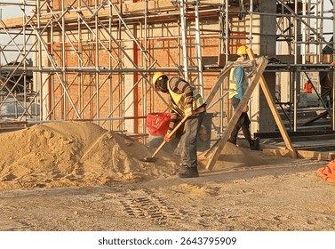 Scaffolding platform for brickwork inside a column and .beam frame providing a safe and stable working surface at required heights for masons. It is made of steel and timber material