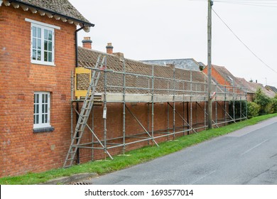 Scaffolding And Roof Repairs, Replacing Roof Tiles On A Rural House In Buckinghamshire, UK