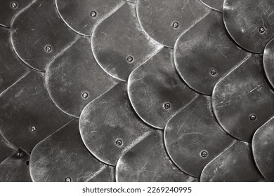 Scale body armour made of steel plates. Medieval knight armor close up photo with selective soft focus - Shutterstock ID 2269240995