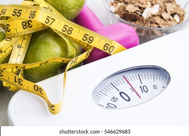 Scale With Cereals, Fruit, Weight And Tape Measure And Concept Of Diet And Healthy Lifestyle