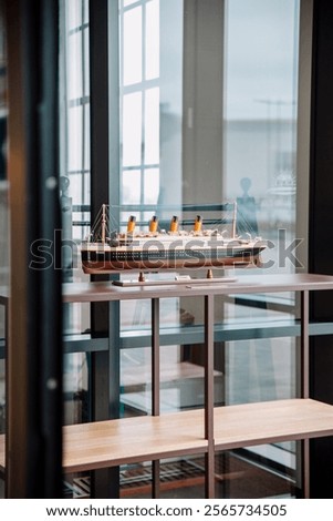 scale model of ship titanic behind glass