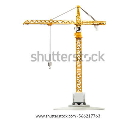 scale model of yellow tower crane isolated on white background