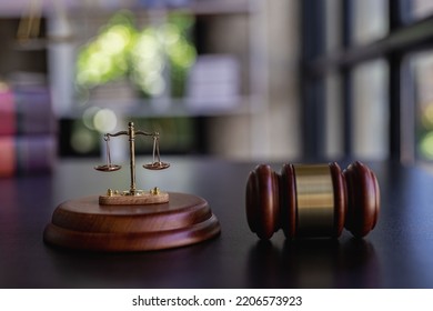 The Scales Of Injustice, The Hammer Of The Law Tiger Skin Judges On The Table In The Conceptual Law Office.