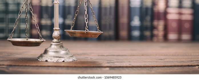 Scales Of Justice L On A Wooden Background, Law Library Concept.