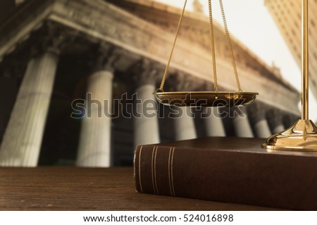 scales of justice on law books with court government background. concept of justice, legal, jurisprudence.