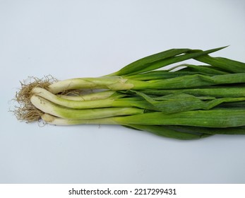 scallions with different arrangements on a white background and can be added to soup dishes