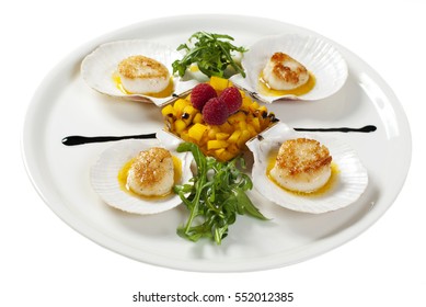 Scallop With Mango Salsa And Rukkola Isolated On White Background