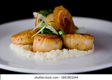 Scallops Sautéed In Butter, Garlic And Served With Jumbo Lump Crab Cake, Cauliflower, Broccoli And Potatoes. Classic American Restaurant Or French Bistro Entree Favorite.