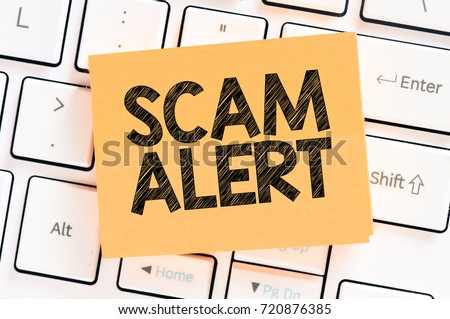 Scam alert/Computer keyboard with paper concept.