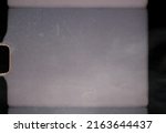 scan of blank or empty 8mm film frame with dust and scratches, cool film border overlay. super 8 template.