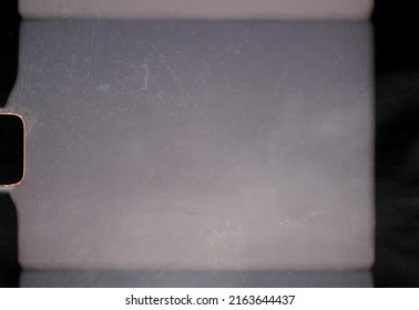 scan of blank or empty 8mm film frame with dust and scratches, cool film border overlay. super 8 template. - Shutterstock ID 2163644437