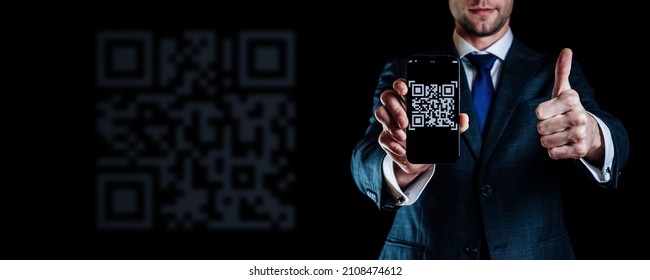 Scan pay. Mobile smartphone screen for payment pay, scan barcode technology with qr code scanner on digital smart phone man holding on black background. Online bill payment concept