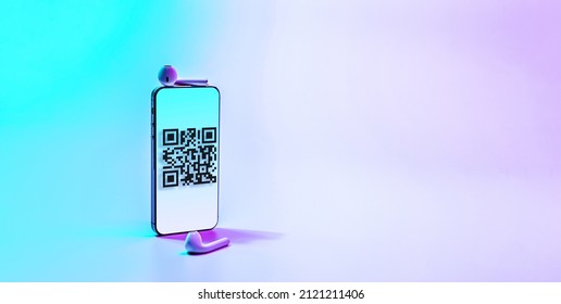 Scan qrcode. Digital mobile smart phone with qr code scanner on smartphone screen for payment, online pay, scan barcode technology on neon background. Retail shop accepted digital pay without money.