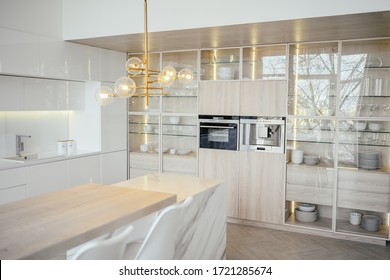 Scandinavian Empty Classic Modern Luxury Kitchen With Wooden, White, Marble Details, New Stylish Furniture, Minimalistic Nordic Interior Design.  Bar Stools, Glass Display Rack, Dishes And Glassware