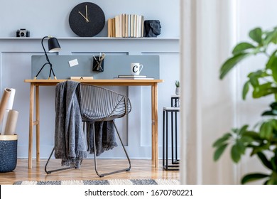 Scandinavian Home Office Interior With Wooden Desk, Design Chair, Wood Panleing With Shelf, Plant, Table Lamp, Office Supplies And Elegant Accessories In Modern Home Decor.