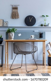 Scandinavian Interior Design Of Open Space With Wooden Desk, Modern Chair, Wood Paneling With Shelf, Plant, Carpet, Office Supplies And Elegant Personal Accessories In Home Decor.