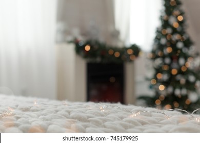 Scandinavian Interior Of Rustic Living Room With Fireplace Decorated For Christmas Holidays, Greeting Card, Nobody. Shallow Depth, Focus On Merinos Plaid