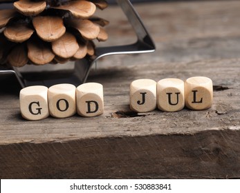 Scandinavian Merry Christmas with wooden dices and the words God Jul