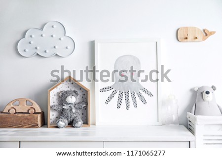 Scandinavian newbornbaby shelf  with mock up photo frame, wooden accessories and toys, teddy bears and cloud. White and cozy childroom. 