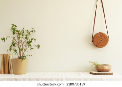 Scandinavian Style Home Interior, Potted Flower, Wooden Bowl, Round Rattan Bag, Shelf With Linen Tablecloth, Free Space On Wall For Framed Art, Design Or Text Presentation, Wall Mockup.