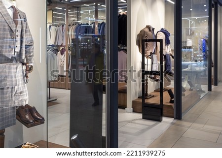 Scanner entrance gate for prevent theft in a clothes store. The sensors detect special tags attached to the products and send a signal to the personnel.