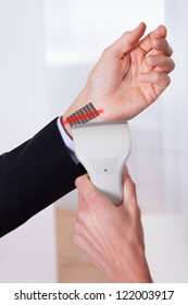 Scanning Barcode On The Hand Using Scanner