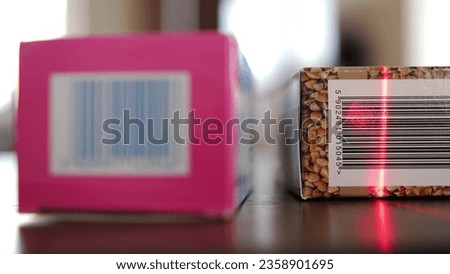 Scanning Barcodes of Multiple Products with Red Laser Barcode Scanner Rack Focus