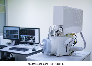 Scanning Electron Microscope (SEM) machine in laboratory and blur computer controller background.