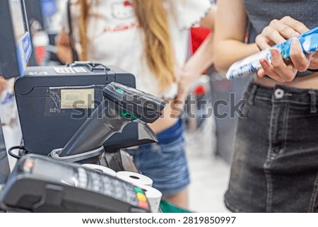 scanning a product's barcode at the self-checkout