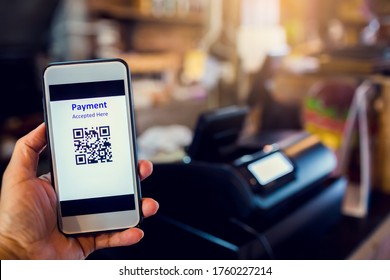 Scanning QR Code Payment With Blurry Cashier Machine At Counter Service In Coffee Shop. Accepted Generate Digital Pay Without Money. E Wallet And Cashless Technology Concept. 