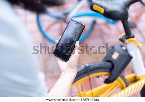 Scanning the QR\
code of shared bicycles with a smartphone in Chengdu, Sichuan\
Province, China, July 29,\
2020