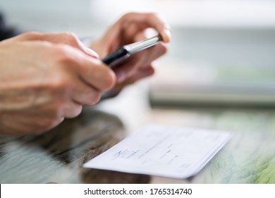 Scanning Remote Deposit Check Document Using Phone. Taking Photo - Shutterstock ID 1765314740