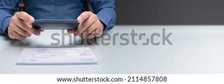 Scanning Remote Deposit Check Document Using Phone. Taking Photo