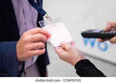 Scanning visitor pass to enter an event or conference - Shutterstock ID 1724919745