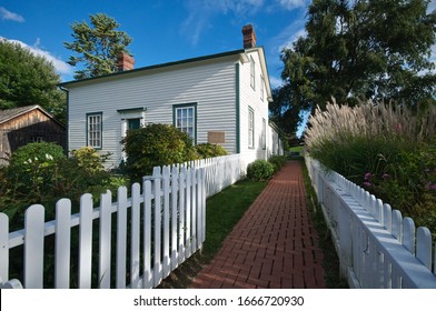 Scarborough, Ontario / Canada - Sept 12, 2014 : house exterior with white picket fence. Scarbourgh, Ontario, Canada.