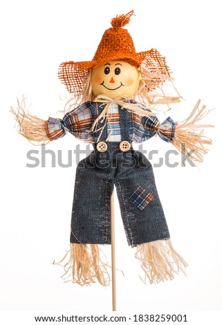 Scarecrow doll. Autumn decorations. Country style. Isolated on white background