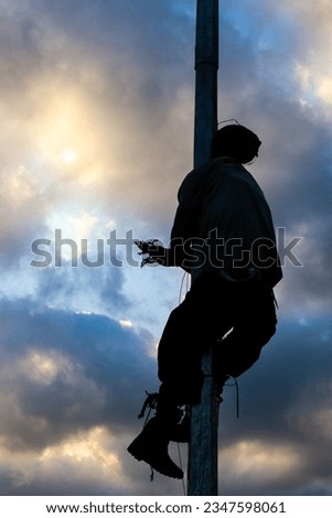 a scarecrow hanging from a pole
