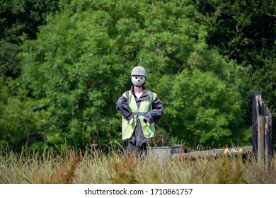 A Scarecrow Wearing A Hi Vis Vest.