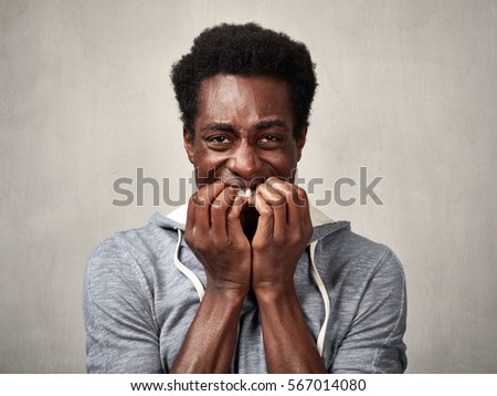Scared black man face.