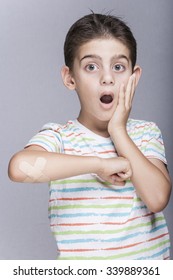 Scared boy with wounded arm
