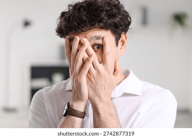 Scared businessman having panic attack in office, closeup