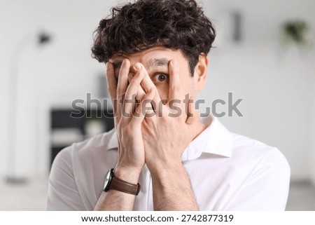 Scared businessman having panic attack in office, closeup